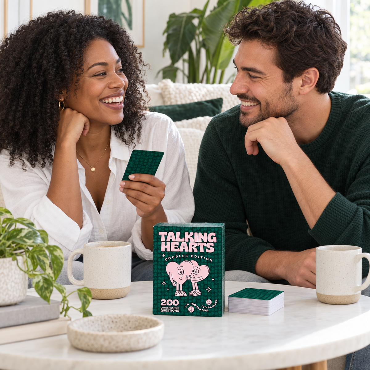 Lifestyle illustration of an adult couple enjoying Talking Hearts over coffee